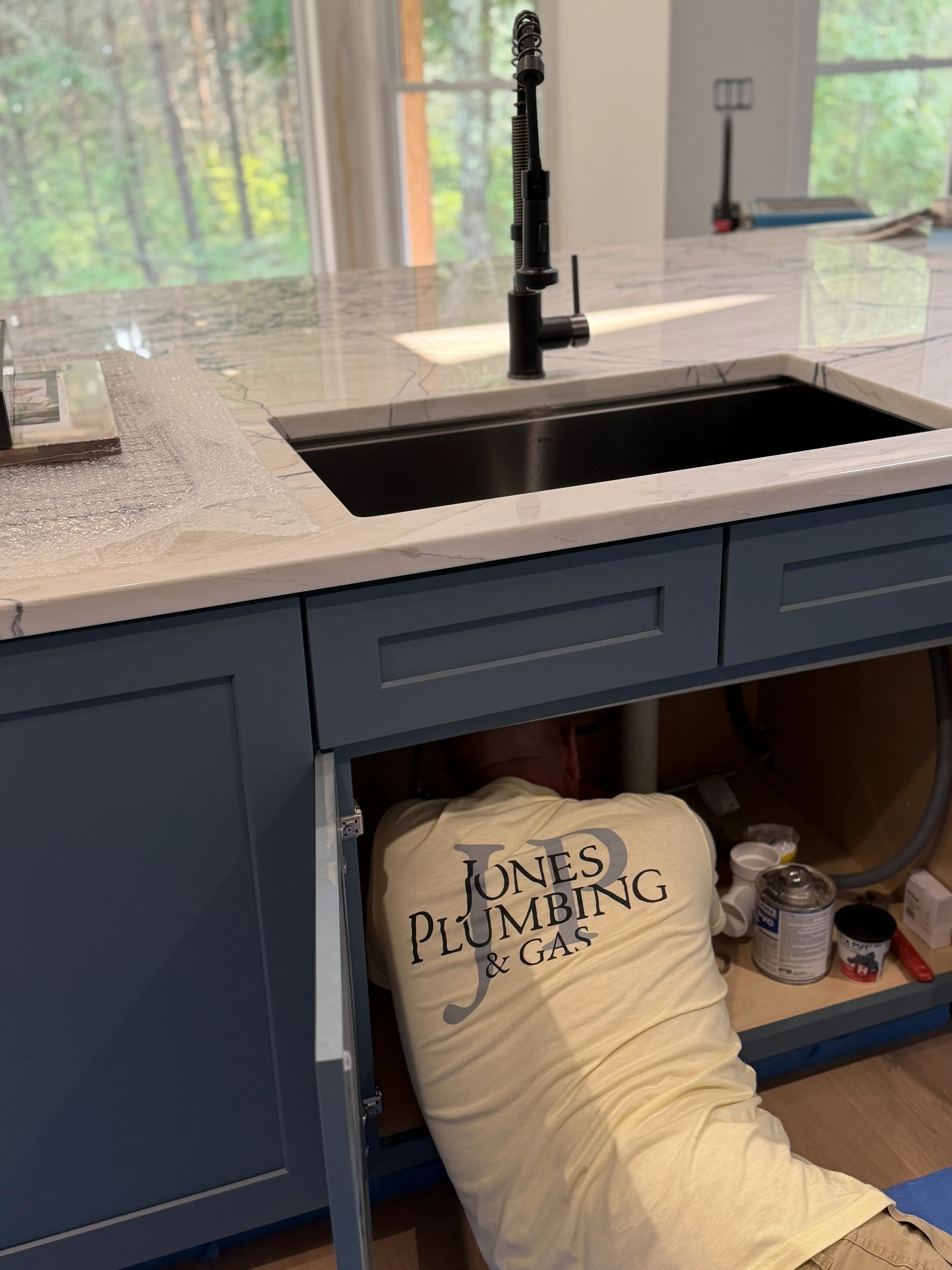 Master Plumber Corey Jones installing luxury undermount sink plumbing
